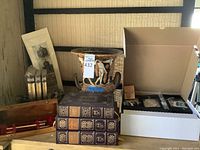 Overview showing urn, books, wooden tray, calligraphy brushes, crafting accents box