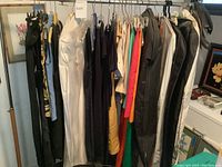 Overview of multiple women's designer garments hung on a rack