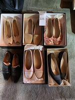 Front/top view of all six pairs in their boxes showing colors and styles