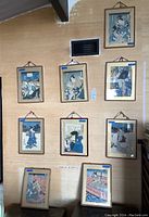 Grid view of nine framed prints on wall