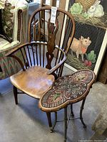 Full view of Windsor armchair next to tapestry top side table