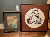 Overview of both framed art prints side by side on floor