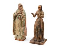 Front view of both Santos figures showing painted surfaces and details