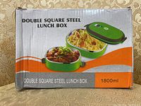 Box packaging showing the product name and an image of the lunch box with food inside, stating 1800ml capacity.