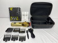 All included items arranged showing gold-tone clipper, six comb attachments, cleaning brush, charging cable, cloth, instruction manual, and carrying case.