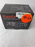 Box front showing Kussla branding and image of the dashcam with three cameras, noting front, rear, and inside (cabin) coverage, labeled as '3 channel dashcam'.