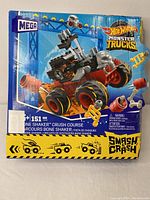 Front side of the Mega Hot Wheels Monster Trucks 151 piece Smash & Crash build set box showing a detailed monster truck image and number of pieces.