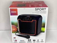 Front of the Ion Sport speaker box showing image of speaker with wired microphone, branding, and product features.