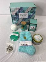 Full view of all included items arranged in front of the gift box
