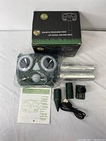 Photo of the repeller device still partially wrapped in plastic with accessories and original packaging box.