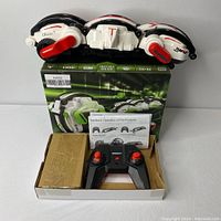 Tumblestunt Rolling Round RC Toy in black, white, red colors with original packaging and controller.