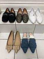 Five pairs of shoes arranged in two rows, showing all shoes clearly for condition and style