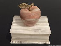 Photo showing white agate trinket box with a solid polished agate apple on top, featuring the metal stem and leaf detail on the apple.