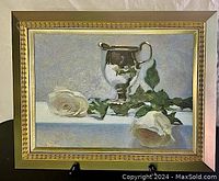 Frontal view of the framed still life on easel showing overall appearance and condition