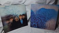 Photo showing the front covers of two vinyl record albums: Rolling Stones Between the Buttons (left) and Pink Floyd Meddle (right).