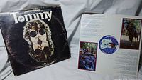 Front and inside fold-out cover artwork for The Who Tommy double album vinyl record with distinctive mirror sunglasses image.