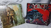 Photo showing the front covers of the two vinyl albums: Jethro Tull Aqualung on the left and Y&T Black Tiger on the right.