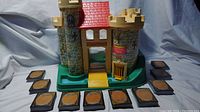 Fisher-Price Play Family Castle #393 front with 12 Magic The Gathering cards laid around in display