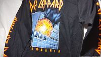 Black long sleeve T-shirt with Def Leppard Pyromania explosion album artwork printed on back.