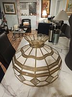 Full view of the Tiffany style glass lampshade showing its shape and metal framing
