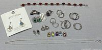Overview of all jewelry items laid out on fabric