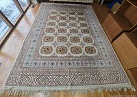 Overhead view of entire rug showing full pattern and fringes