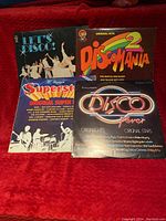Photo showing four vintage disco vinyl record covers: Let's Disco, Discomania 2, Superst Original Super 1, and Disco Fever.