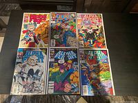 Top-down image of six Alpha Flight comics arranged in two rows of three, showcasing comic covers and condition.