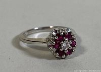 Top view showing central diamond and surrounding rubies cluster