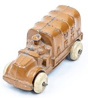 Front angle of cast US Army truck showing 'U.S. ARMY' on the side with paint wear and ivory wheels