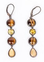 Front view of both sterling silver dangle earrings showing three stones each with natural earthy colors including Tiger's Eye and other earth-toned cabochon stones.