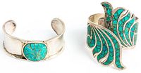 Two sterling silver cuff bracelets with turquoise stones: one wide cuff with a large cracked turquoise medallion, one hinged cuff with intricate turquoise inlay missing some stones, both Southwestern style.