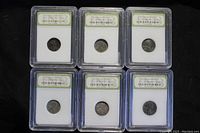 Six slabbed 1943 Lincoln Steel Cents arranged in two rows of three on a black background.