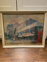 Front view of the framed MCM pastel print showing the New Orleans building scene and frame condition.