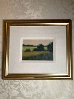 Full front view of framed painting showing gold frame, white mat, and 5×7in board with oil landscape