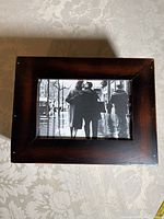 Top view of wooden photo box with clear cover displaying black and white photo of couple