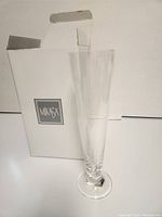 Single Mikasa Munich pilsener glass standing in front of box showing Mikasa logo