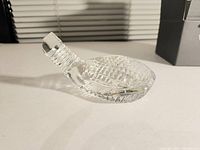 Side angle showing the clear Waterford crystal golf club head with detailed cuts and a faceted surface.