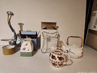 Photo of all items in the lot: large wall hook, small vase in box, Mikasa picture frame, Japanese teapot, Bridgewater pitcher with bird pattern