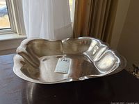 Front view of rectangular serving dish showing interior space and scalloped rim.
