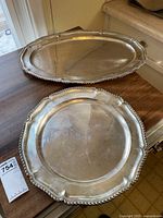 Round and oval platters displayed side by side on tabletop