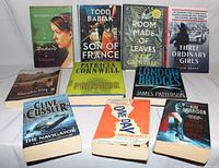 Top view of the 10 books fanned out showing all front covers clearly