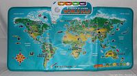 Front view of the LeapFrog Touch & Learn World Map showing the labeled continents, oceans, and illustrated animals and landmarks, with the control panel visible at the top.