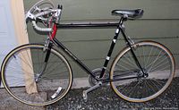 Full side view of the Motobecane road bike showing frame, wheels, saddle, and handlebars.