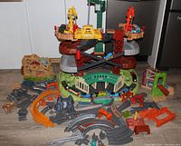 Full overview of playset with roundhouse, cranes, and tracks spread around
