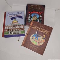 Three pop-up books with historical themes: Freedom Trail Pop-Up Book of Boston, Battle (Medieval Days and Knights), and Gods & Heroes.