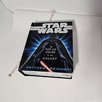 Cover view of the Star Wars pop-up book showing Darth Vader artwork with the title and author name.