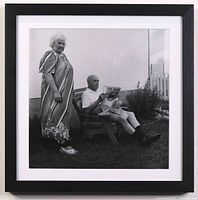 Front view of framed black-and-white gelatin silver print featuring elderly couple outdoors