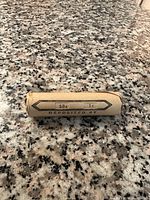 Photo of a penny roll on a granite countertop.