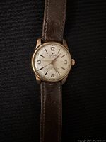 Front close-up view of the watch showing dial and case details.